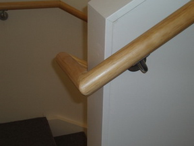 Round timber handrail for staircases by Woodcroft